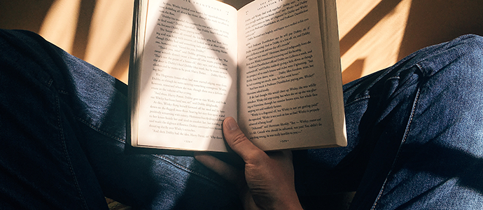 hand holding open book