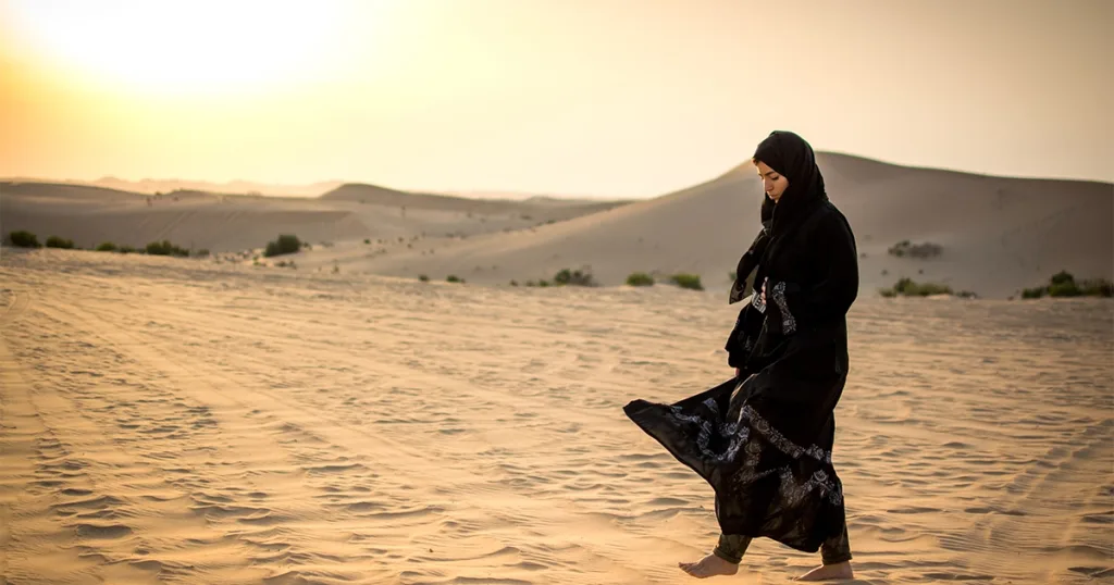 Woman walking in the desert.