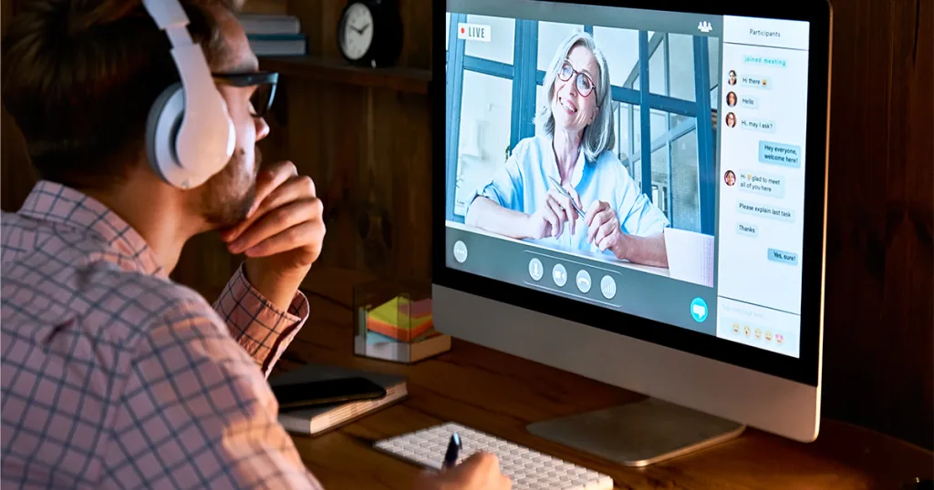 man-watching-woman-teach-on-screen