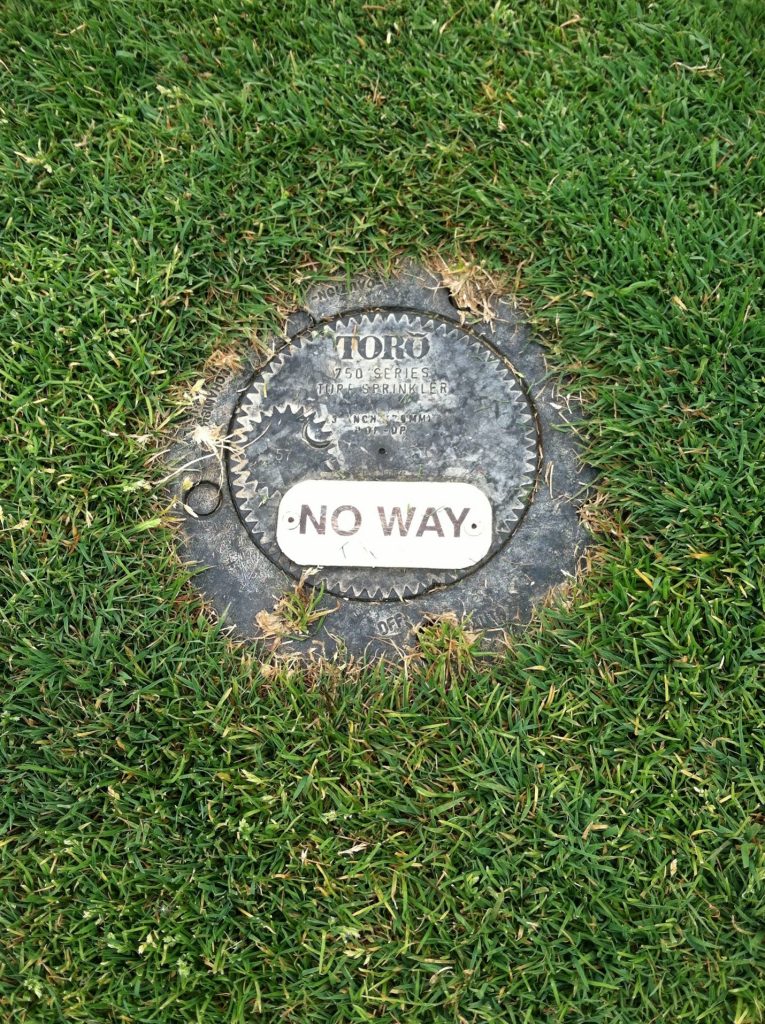 A golf marker reading "no way."
