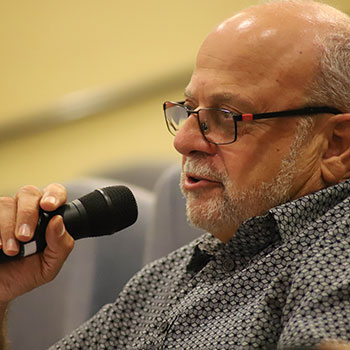 Photo of Dr. Salim Munayer speaking.
