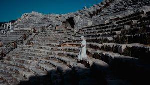 Woman on Stairs in Patara Antique Theatre in Antalya in Turkey.