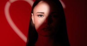 woman wiith a heart shadow over her face